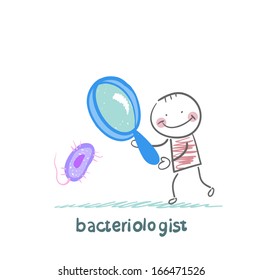 bacteriologist looks through a magnifying glass on microbes