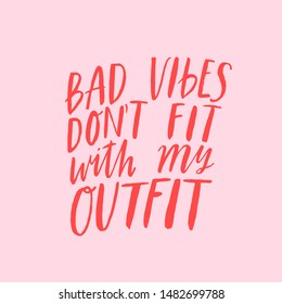 Bad vibes don't go with my outfit. Hand written inspirational lettering with brush pen texture effect. Vector fashion print design. Trendy ink typography isolated on pink background. T-shirt print