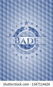 Bade blue badge with geometric pattern.