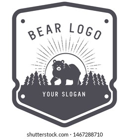 badge with bear mascot, sunrise and spruce forest for summer camp, expedition club. Label for adventure club or recreation center. Mascot symbol for scouts and active travelers