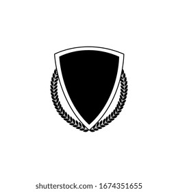 Badge and icon of black royal shield with laurel wreath. Isolated vector illustration of a badge with a shield.