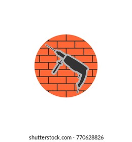Badge of a jackhammer on a brick wall