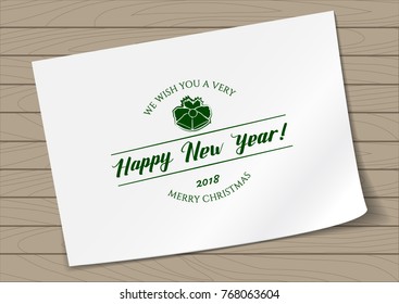 Badge Merry Christmas and Happy New Year with Hand Drawn Lettering and Bells Icon on A4 Sheet Paper on Wooden Background. Green Logo Emblem Vector Illustration.