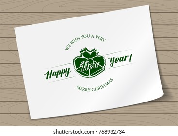 Badge Merry Christmas and Happy New Year with Hand Drawn Lettering and Bells Icon on A4 Sheet Paper on Wooden Background. Green Logo Emblem Vector Illustration.