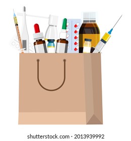 bag from a pharmacy with medicines for throat, remedy for the common cold, thermometer, pills, syringe for injection