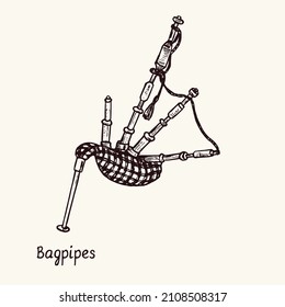 Bagpipes. Ink black and white doodle drawing in woodcut style with inscription.