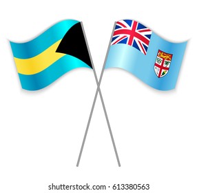 Bahamian and Fijian crossed flags. Bahamas combined with Fiji isolated on white. Language learning, international business or travel concept.