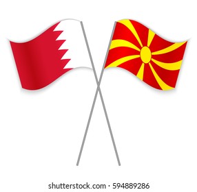 Bahraini and Macedonian crossed flags. Bahrain combined with Macedonia isolated on white. Language learning, international business or travel concept.