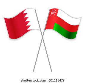 Bahraini and Omani crossed flags. Bahrain combined with Oman isolated on white. Language learning, international business or travel concept.