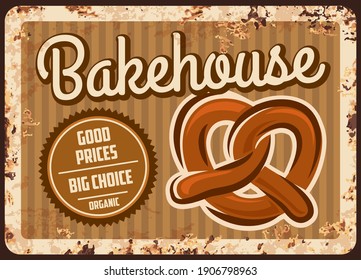 Bakehouse rusty metal plate, vector bakery shop production vintage rust tin sign with fresh pretzel. Bake house products assortment retro poster, pastry and bakery choice ferruginous promo card design