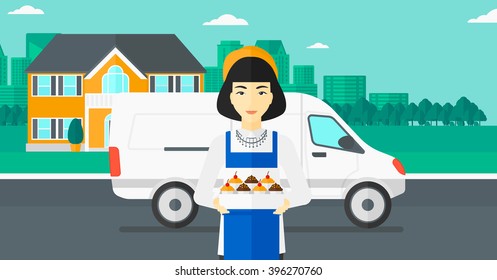 Baker holding box of cakes.