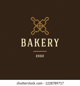 Bakery badge or label retro vector illustration. Two crossed rolling pins silhouettes for bakehouse. Typographic logo design.