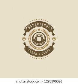 Bakery badge or label retro vector illustration. Rolling pins and donut silhouettes for bakehouse. Typographic logo design.