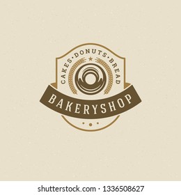 Bakery badge or label retro vector illustration. Wheat and donut silhouettes for bakehouse. Typographic logo design.