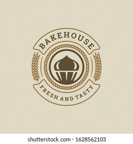 Bakery badge or label retro vector illustration cupcake and wheat silhouettes for bakehouse. Vintage typographic logo design.