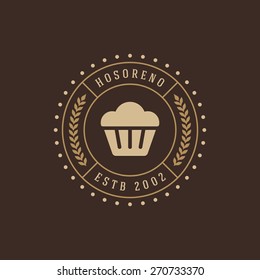 Bakery badge or label retro vector illustration. Cupcake silhouette for bakehouse. Vintage typographic logo design. Bakery badge or label retro vector illustration. Cupcake silhouette for bakehouse. Vintage typographic logo design.