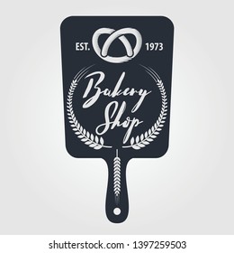 Bakery or bread shop logo, emblem in vintage style. Vector illustration