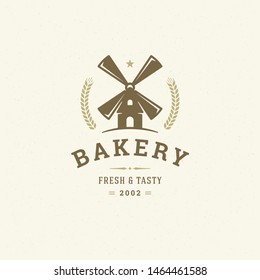 Bakery logo or badge vintage vector illustration mill silhouette for bakery shop. Retro typographic logotype design.