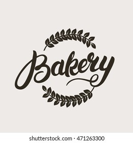 Bakery logo. Handwritten inscription. Hand written calligraphy lettering typography badge, emblem with wheat ear. Vector illustration.