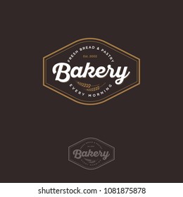 The bakery logo with spikelet. Bread and baking emblem. Vintage bakery logo. Gold and white inscription on a dark background.
