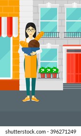 Bakery owner with bread.