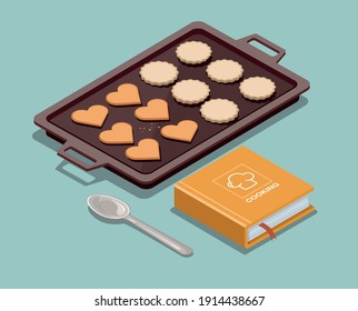 Baking sheet with cookies, recipe book and spoon