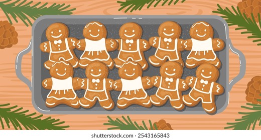 A baking tray with hot gingerbread cookies on the table, surrounded by fir branches and pinecones.