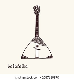 Balalaika. Ink black and white doodle drawing in woodcut style with inscription.