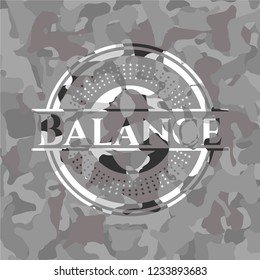 Balance on grey camo texture