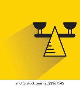 balance scales icon with shadow on yellow background