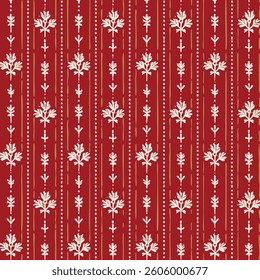 a balanced composition with white plant motifs and dots on a red background