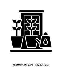 Balcony garden black glyph icon. Watering plants on windowsill. Cultivate vegetables indoor. Home horticulture. Gardening for hobby. Silhouette symbol on white space. Vector isolated illustration