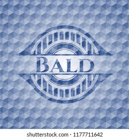 Bald blue badge with geometric pattern.