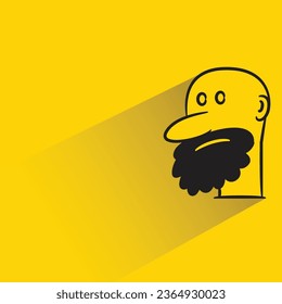 bald man with shadow on yellow background