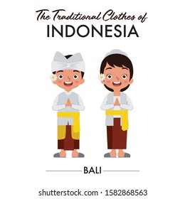 Balinese boy and girl are wearing Indonesian traditional clothes from Bali, Indonesia, as they saying welcome