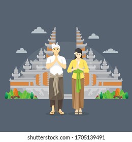 balinese couple namaste greetings in front of gate