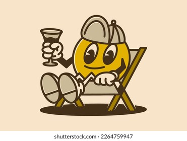 El personaje de la mascota de la cabeza de bola puede relajarse en la silla y tomar una copa