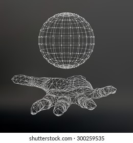 Ball on the arm. The hand holding a sphere. Polygon ball. Polygonal hand. Black background. The shadow of the objects in the background.