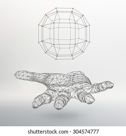 Ball on the arm. The hand holding a sphere. Polygon ball. Polygonal hand. White background. The shadow of the objects in the background.