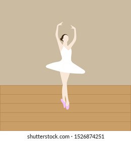 Ballerina dancing on a wooden floor