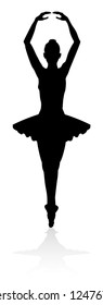 Ballet dancer in silhouette dancing in pose or position