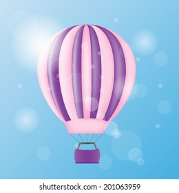 Ballon with purple stripes in the sky