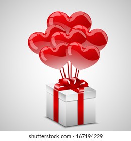 Balloon hearts and a white present.