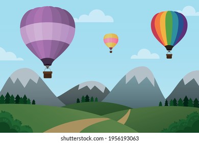 Globo en el cielo sobre el fondo de montañas y campos