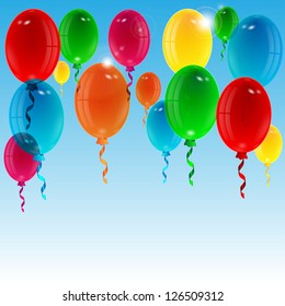 balloons of different color on a background blue sky