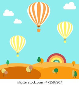 Balloons flying over the autumn landscape