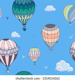 Balloons seamless vector pattern on blue background. Many differently colored striped air balloons flying in the clouded sky. Clouds and birds soaring in the sky. Travel and vacation. 