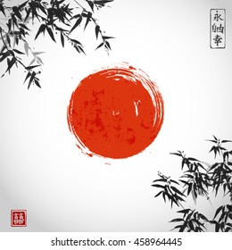 Bamboo leaves and red sun on white background. Traditional Japanese ink painting sumi-e. Contains hieroglyphs - eternity, freedom, happiness, double luck.