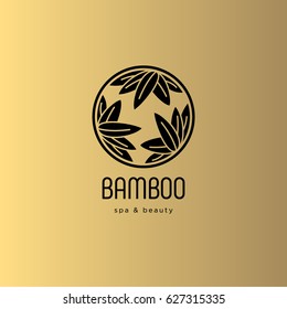 Bamboo spa salon logo. Spa emblem. Bamboo leaves in a circle with letters. Gold background.