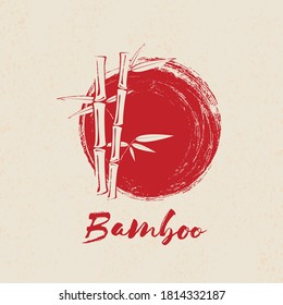 Bamboo tree and leaves on red grunge circle background.
